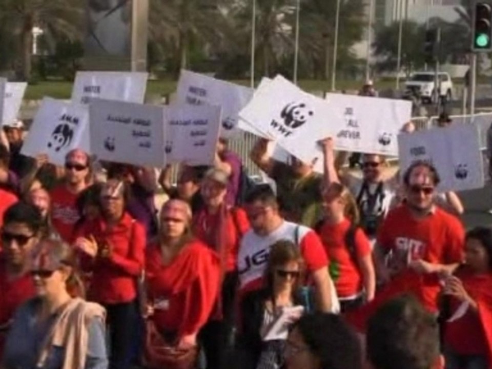 Hundreds march for climate change in Doha
