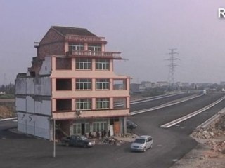 Chinese farmer loses home to highway