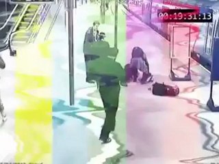 Woman carried up station escalator upside down after getting stiletto caught in step