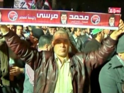 Egyptians call on the president to resign while others urge Mursi to stay strong