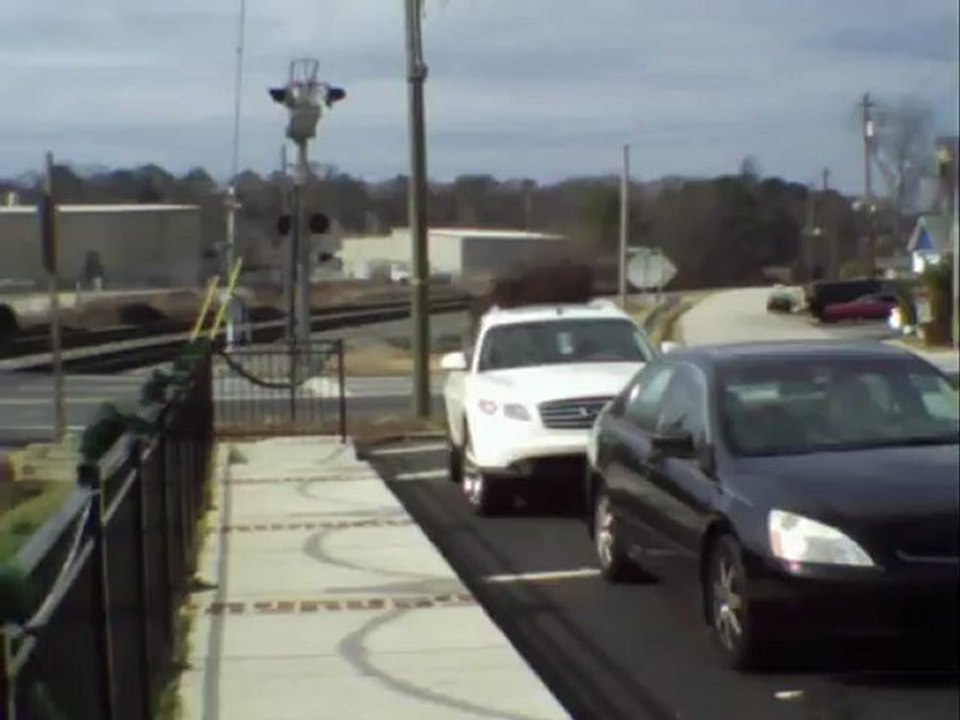 Norfolk Southern tank train with 2 covered hoppers northwest through Austell Ga.