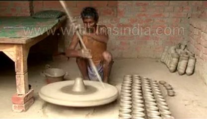 Potter making clay items