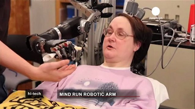 Paralysed woman feeds herself with robotic arm