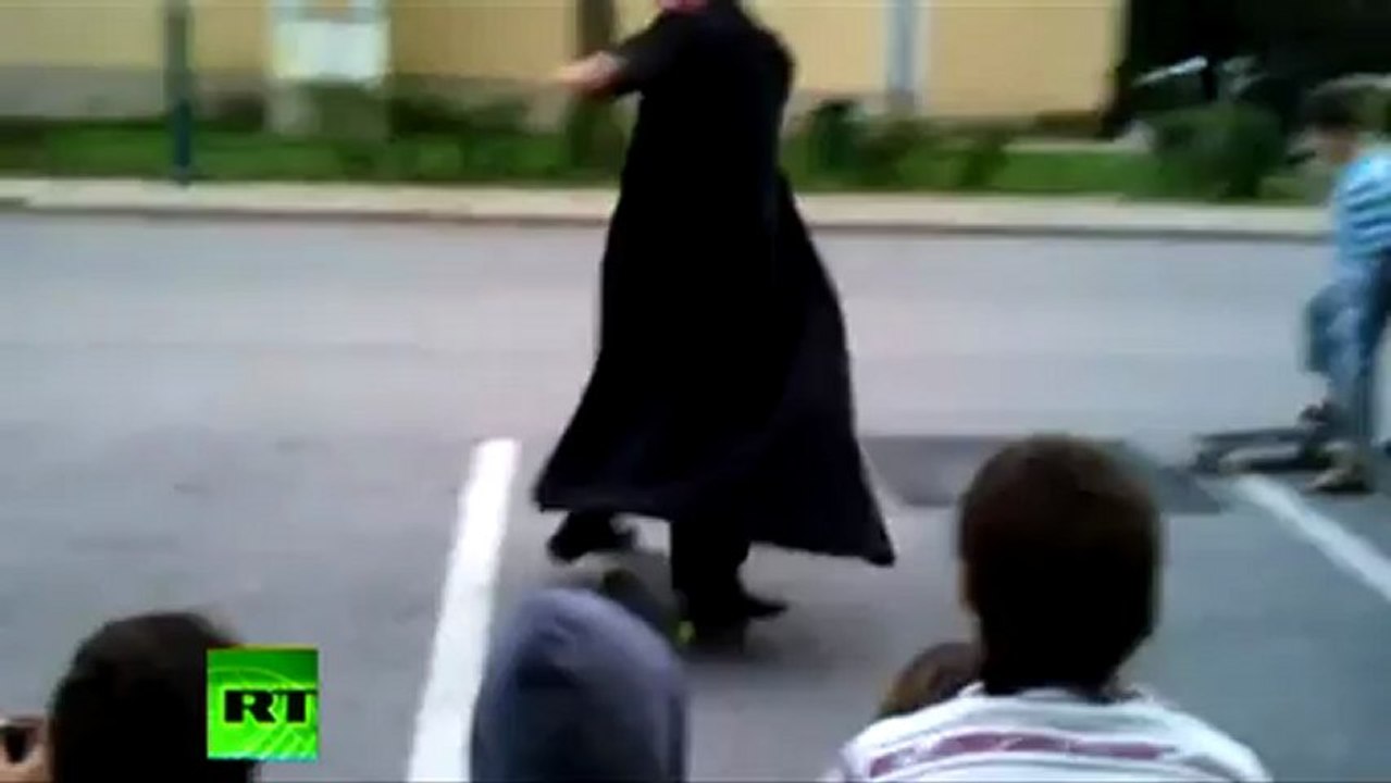 Skateboarding priest shows class in Hungary