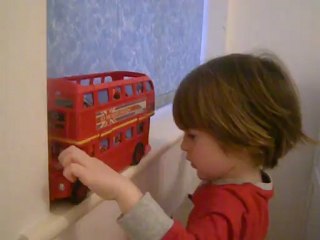 Olly playing with the big bus