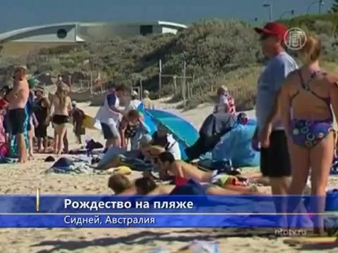 Санта-Клаус прибыл в Австралию на сёрфе