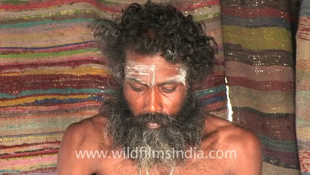 2630.Aghori sadhu with skull, applying human ash!.mov