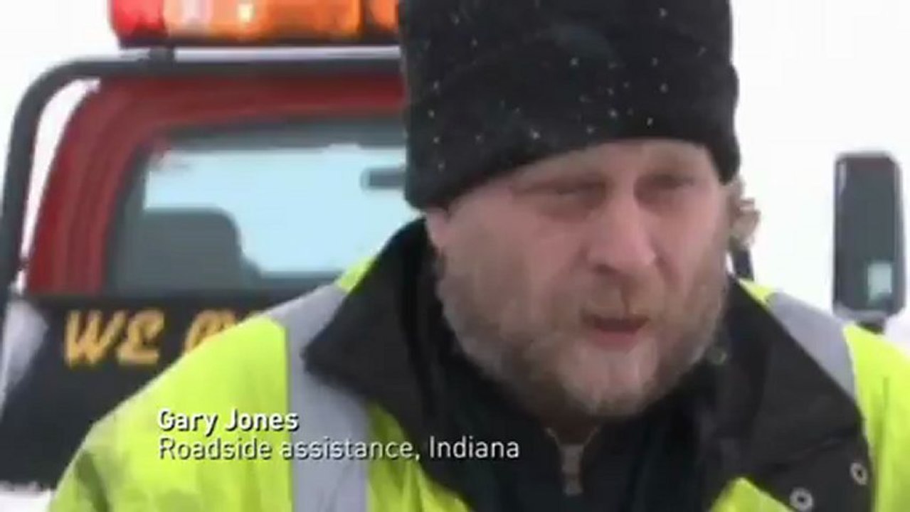 Vehicles career off roads as blizzards hit the US
