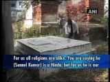 A Hindu serves as caretaker of a Christian graveyard.mp4