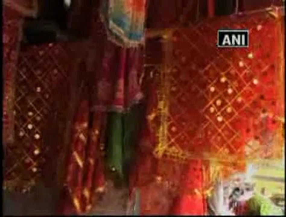 Hindus and Muslims collectively make scarves for Goddess Durga.mp4