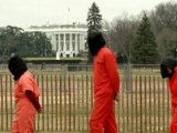 Protesters in orange jumpsuits, hoods demand Obama close Guantanamo