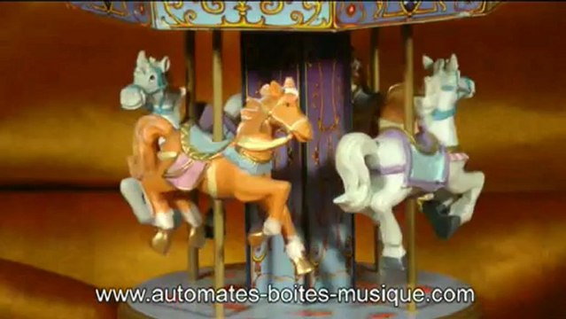 Lutèce Créations, spécialiste des boîtes à musique et des automates présente un carrousel musical miniature de sa collection de manèges musicaux animés (carrousels, grandes roues et autres manèges miniatures).