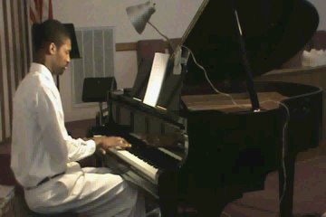 Bro. Henry " Love me Tender" On Piano