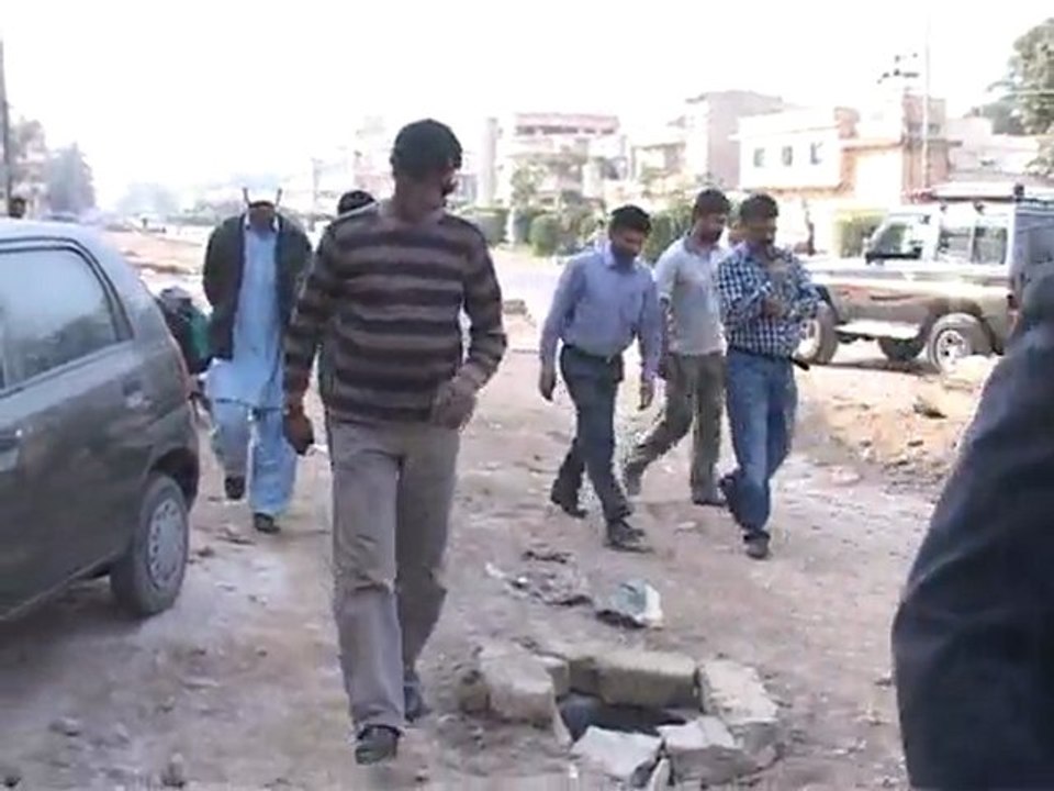 9th Jan 2013 New Karachi Town Administrator Afaq Saeed along with concern officer inspecting the installation of curb stone on Sector 11-B North Karachi 2400 Road.