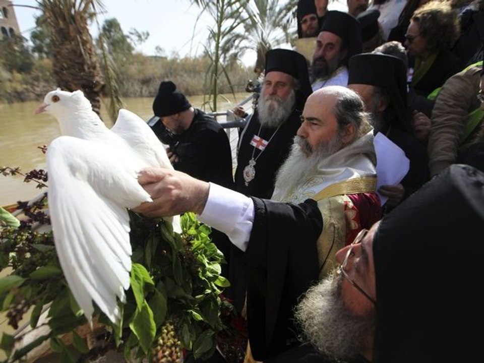 Worshippers Re-enact Baptism Of Jesus Christ In The Jordan River
