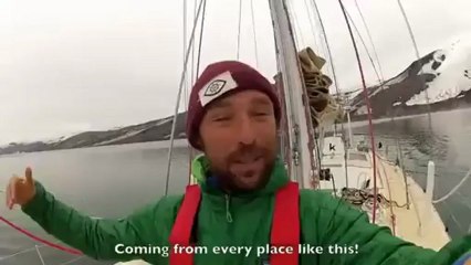 Surfing on Antarctican iceberg with penguins, by Kepa Acero