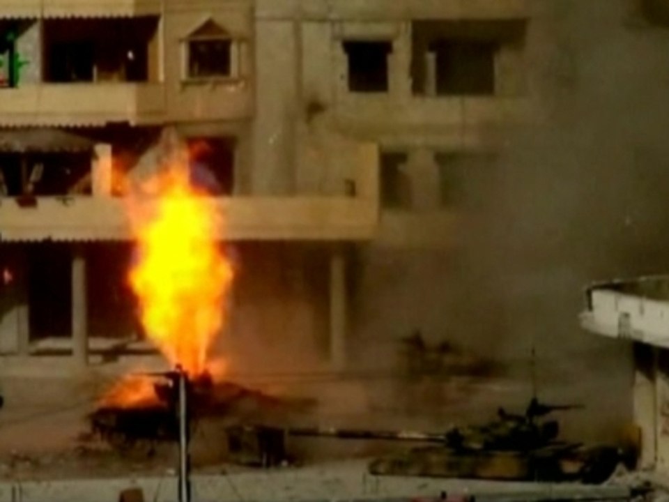 Amateur video appears to shows airstrikes and Syrian tanks coming under attack