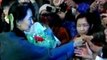 Aung San Suu Kyi greeted by supporters in South Korea
