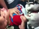 Mother restrains terrified three-year-old while boy is given a TATTOO