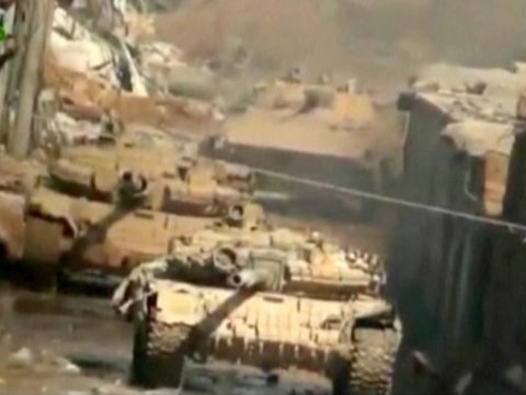 Syrian tanks shell rebel areas outside Damascus