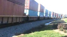 Norfolk Southern stack train through Austell Ga. into Whitaker Yard. with friendly Mow.
