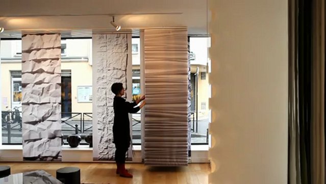 Sliding panels, gliding panels, panel blinds, vertical blinds, etc : These are different names given to Lily Latifi's best selling product : a track system with multiple ways installed on the ceiling or walls with gliding textile panels.