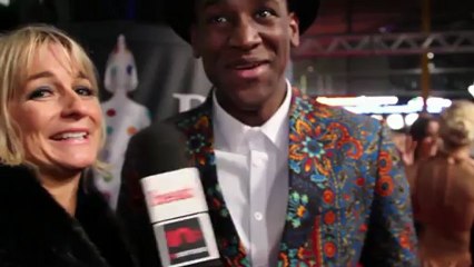 Labrinth talks to heat at the Brit Awards 2013, while wearing quite the jacket