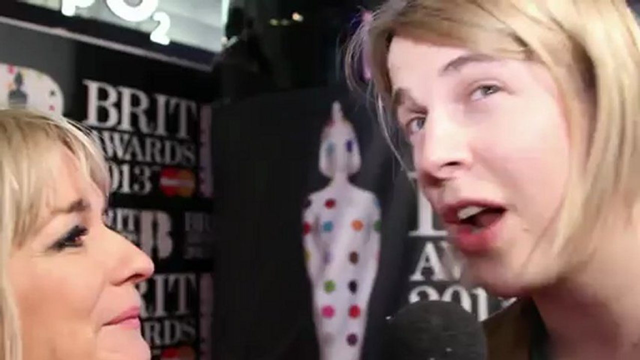 Critic's Choice winner Tom Odell talks to heat at the Brits 2013 red carpet