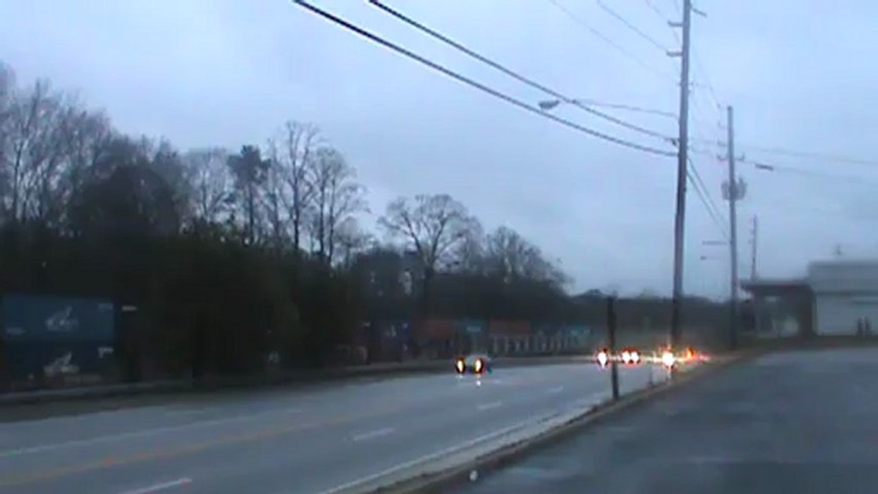 Norfolk Southern rail maintmence and rail hauling train southeast through Austell Ga.