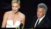 Actress Charlize Theron and actor Dustin Hoffman present onstage Oscars 2013