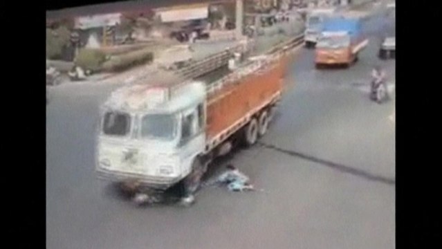 Woman miraculously survives being run over by truck