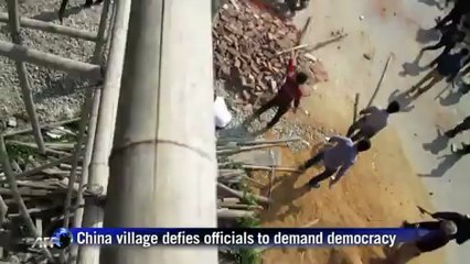 China village defies officials to demand democracy