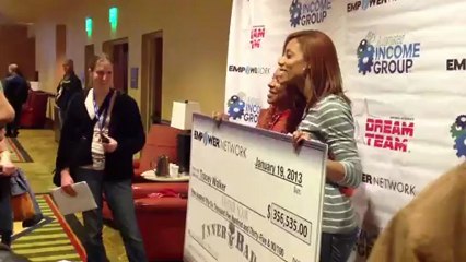 Tracey Walker mingles with the crowd and showed off her huge check at Austin Texas Badass Event.