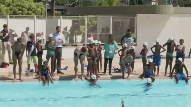 Michael Phelps joins young swimmers from favela on visit to Rio