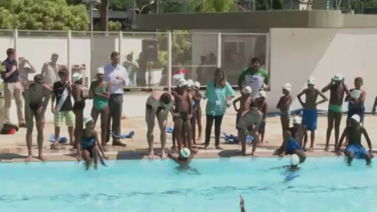 Michael Phelps joins young swimmers from favela on visit to Rio