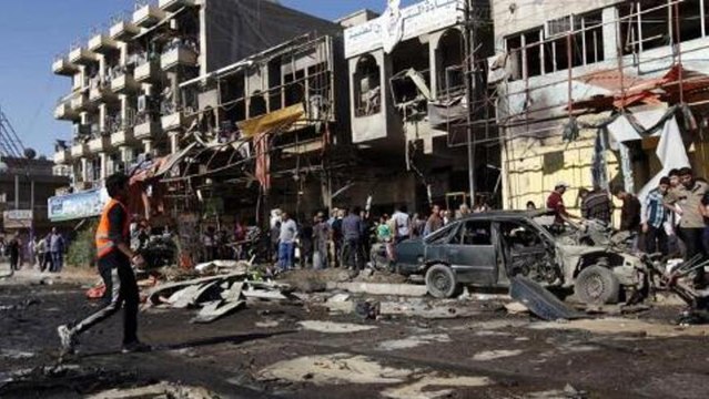 Series of bomb blasts kill scores in Baghdad
