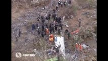 China tour bus plunges down ravine