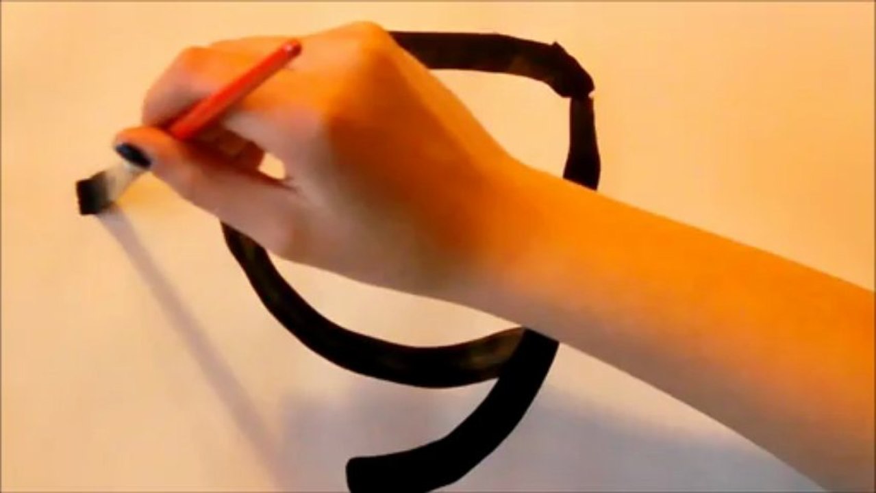 little girl tries japanese calligraphy