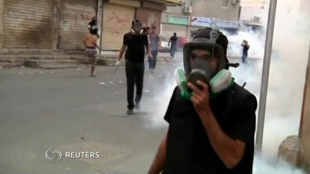 Fire litters Bahrain streets as police and protestors clash