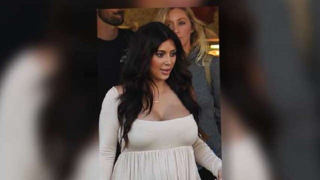 Kim Kardashian Busts Out of Maxi Dress