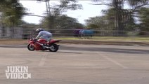 Red Moto Wheelie Loses Control