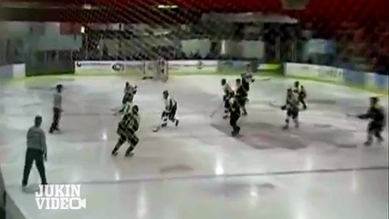 Excited Hockey Player Jumps Through Glass