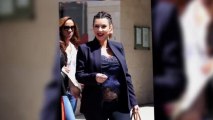 Pregnant Kim Kardashian Flashes Bare Baby Bump in a Peekaboo Lace Top