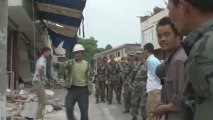 China quake rescuers battle landslides, debris