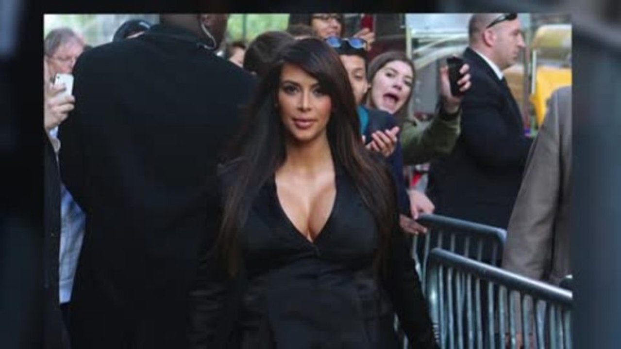 Kim Kardashian Busts Out of Satin Coat After Reuniting With Kanye