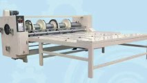carton equipment corrugated paperboard slicing the corner separating paper rolling the line opening the slot machine