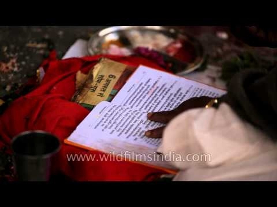 Temple priest reading the Bhagavad Gita at Varahi Mata temple