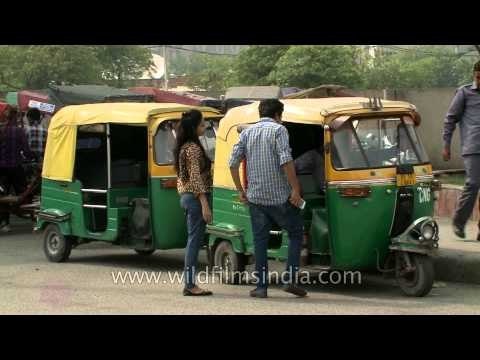 Auto rickshaws waiting for commuters at Netaji Subhash Place metro station