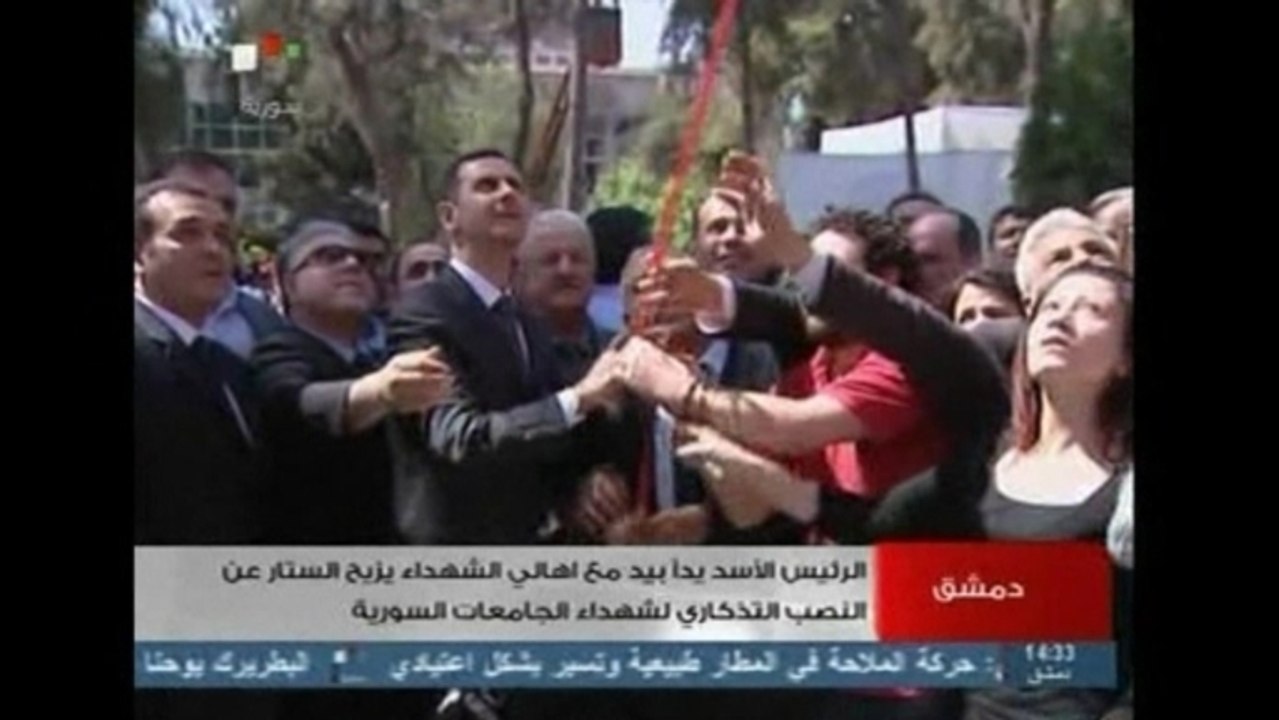 Supporters mob Assad