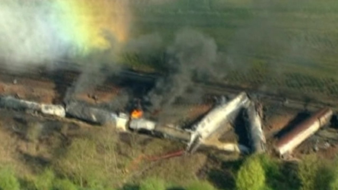 Train carrying toxic chemicals derails, triggering massive fire